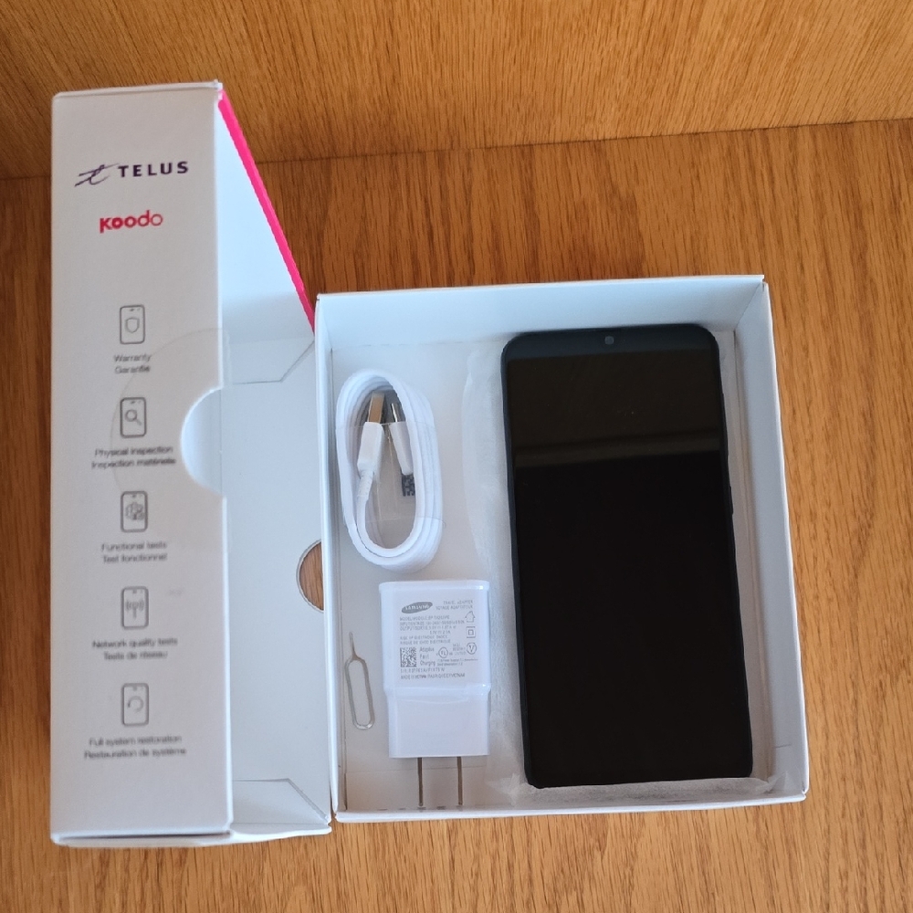 Samsung Smartphone with Black Finish and Accessories